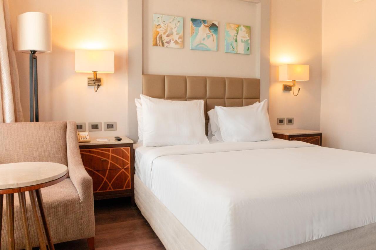 Sharm Dreams Vacation Club - Aqua Park Hotel Bagian luar foto A bedroom at the hotel